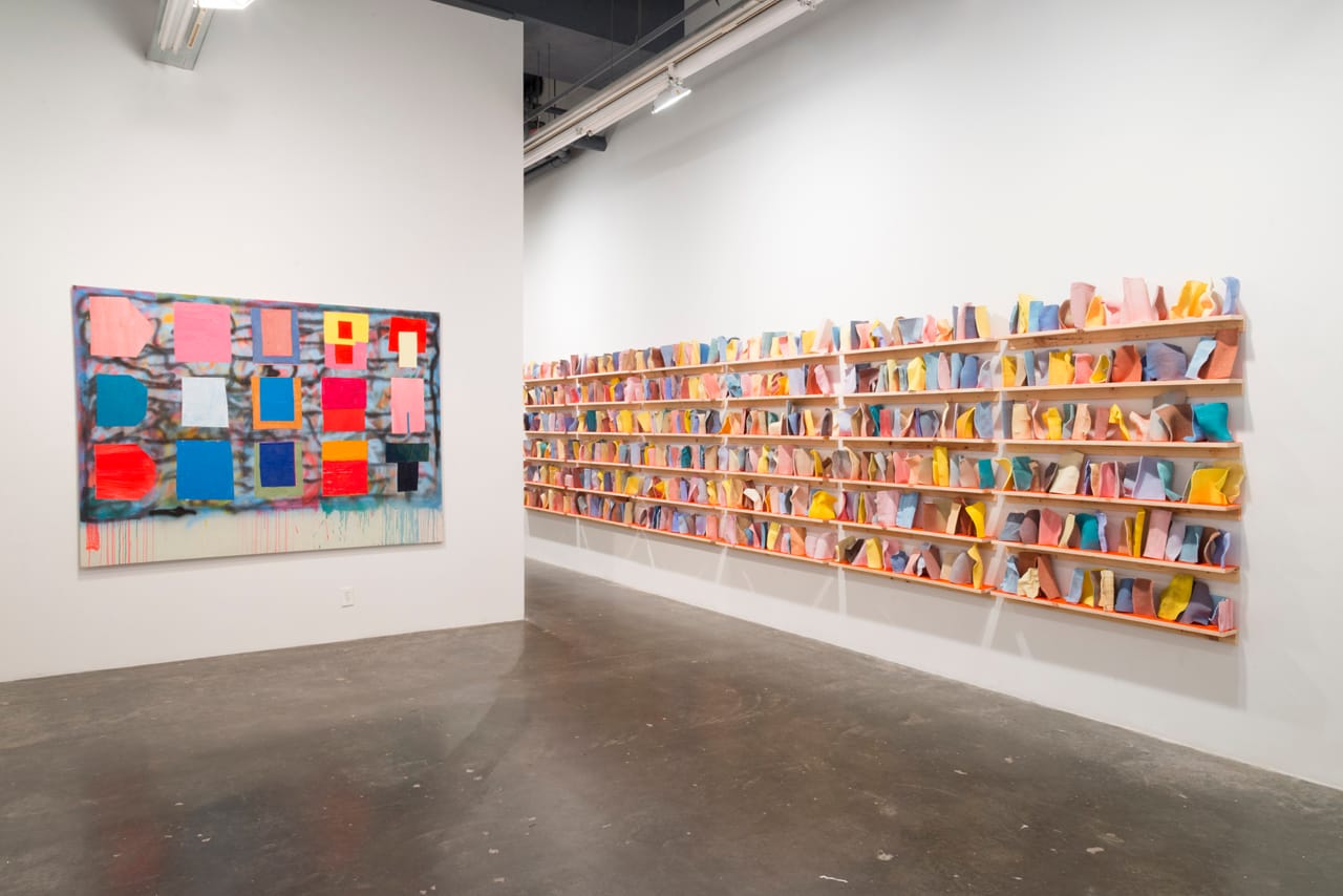 Installation view, 'Ezra Johnson: It's Under the Thingy,' with “3 Shelves of Dish Cloths” (2014) on right