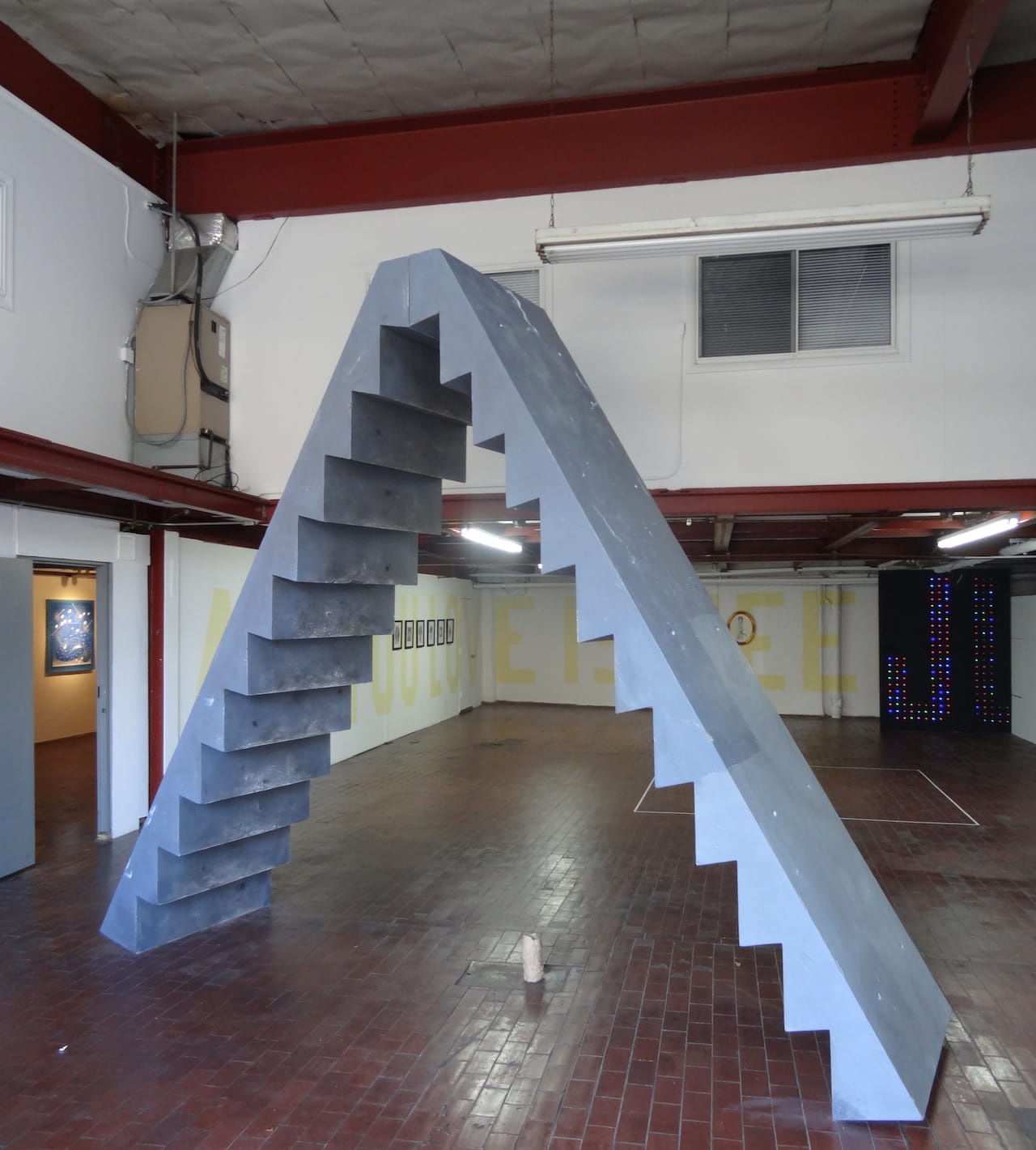 Sculptures by Antoniadis & Stone, presented by Bushwick's Harbor, at the entrance to the Vazquez Building (all photos by the author for Hyperallergic)