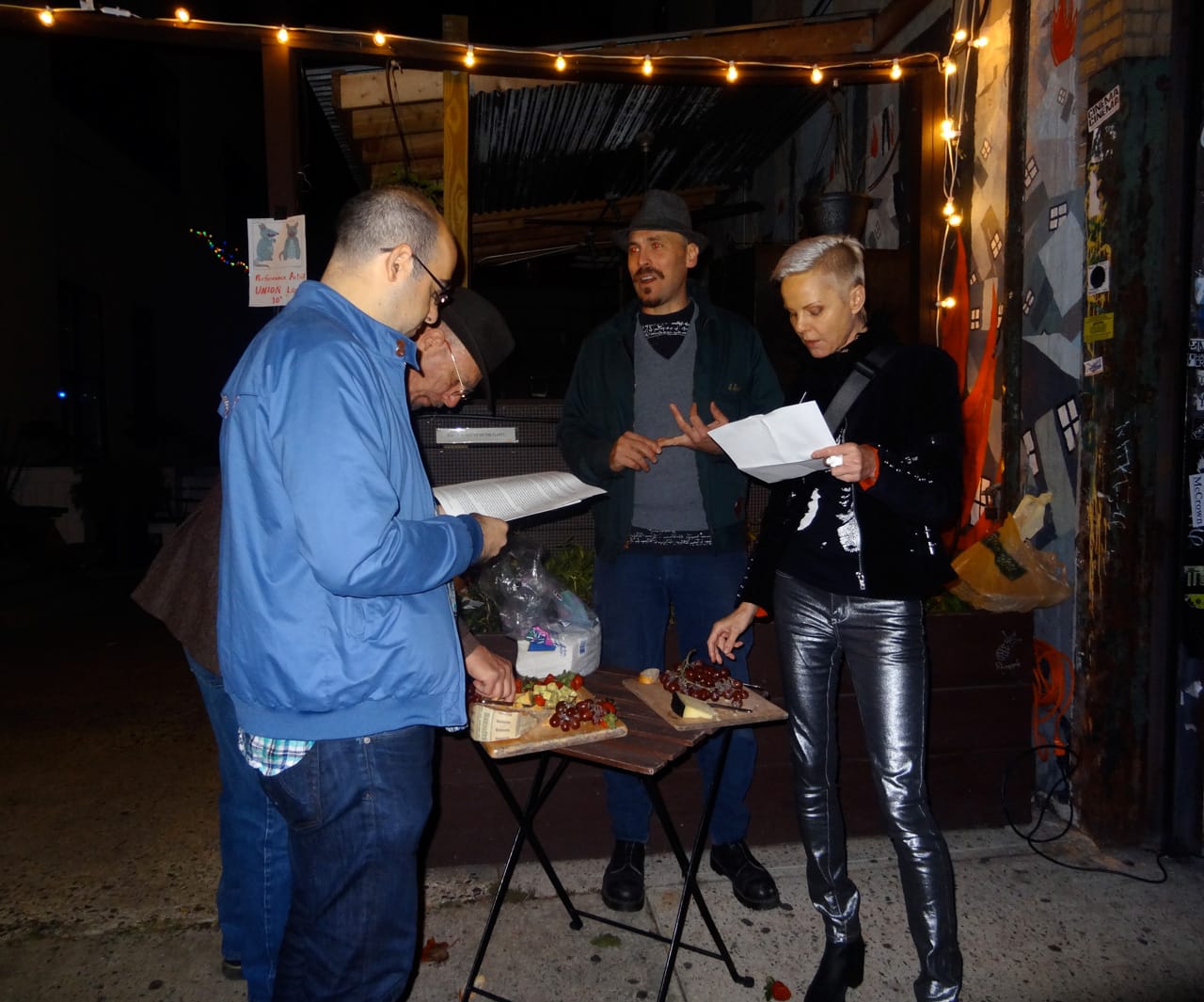 John Bonafede offers passersby cheese, grapes, and information