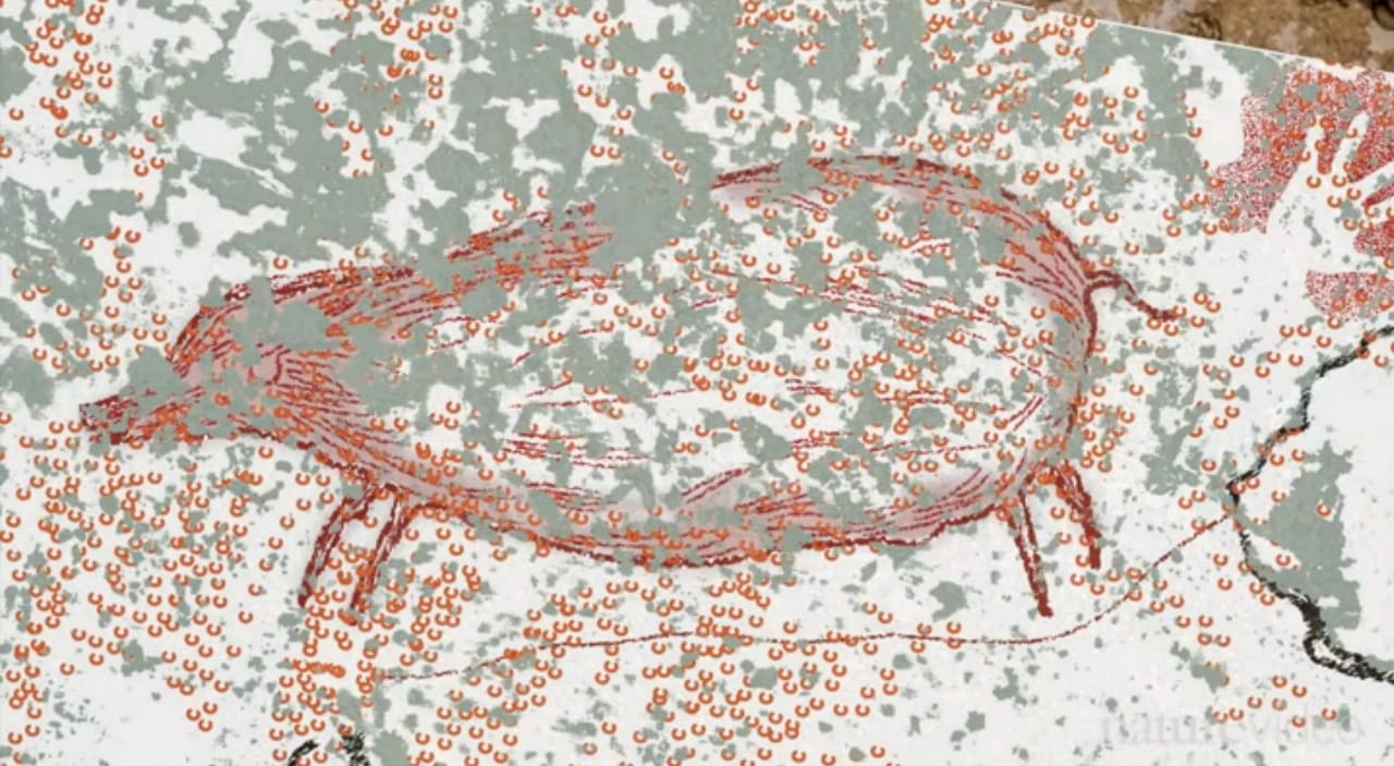 The "pig-deer" and the adjacent hand outline (screenshot by the author via YouTube/Nature.com)