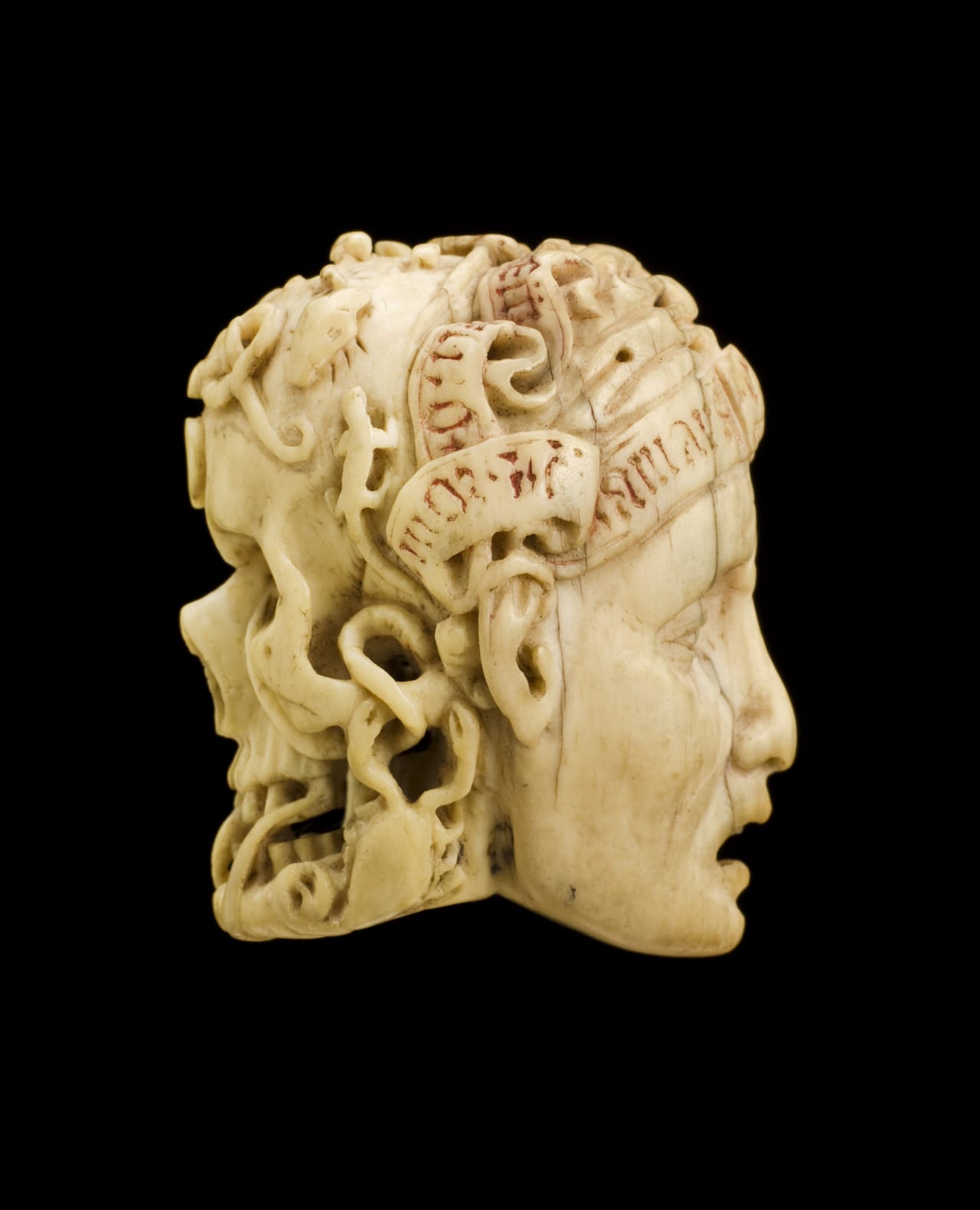 Ivory carving of a skull covered with worms and a human face (via Science Museum, London/Wellcome Images)