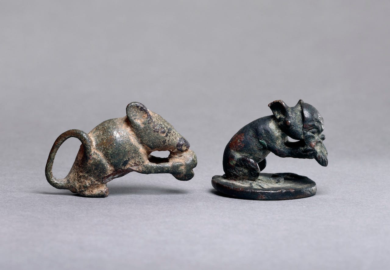Roman empire, Figure of dormouse eating nut and Lamp lid with crouching mouse holding a Papposeilenos mask, first century, cast bronze. Object reg. no: GR 1873,0820.257, British Museum, London, United Kingdom. © The Trustees of the British Museum/Art Resource, NY.