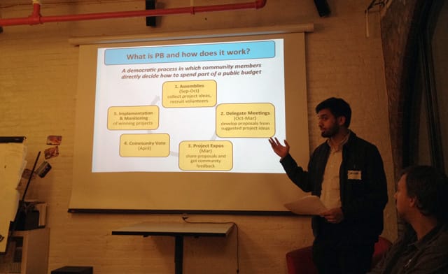 Shehab Chowdhury speaking to those gathered for the Oct 22, 2014 participatory budgeting meeting in Brooklyn, NY's 39th District focused on Arts, Community & Culture. (All photos by author for Hyperallergic.)