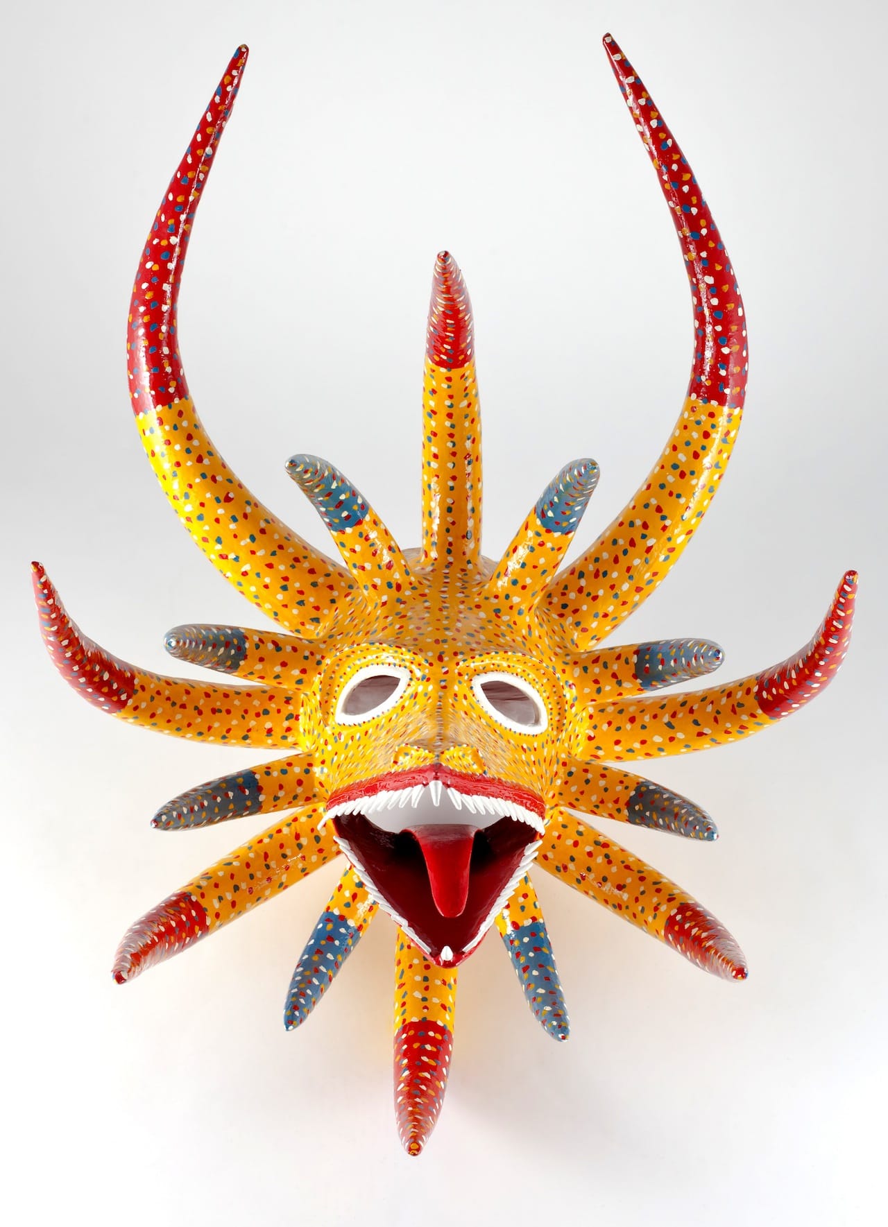 Miguel Caraballo García. Mask, 2011. Molded, modeled and polychromed papier-mâché Santo. Tomás, Ponce, Puerto Rico.  Image Courtesy of Fomento Cultural Banamex, A.C.