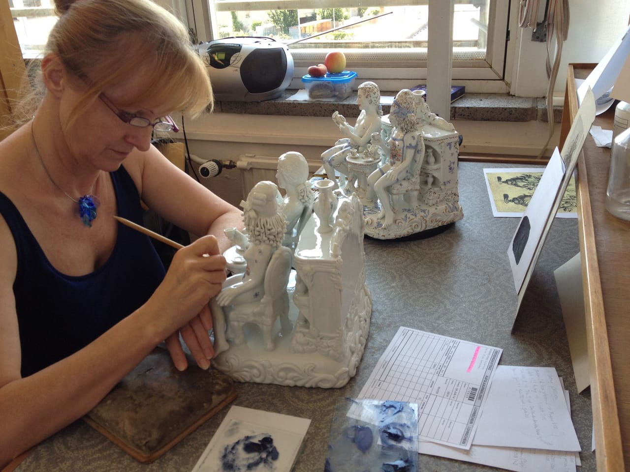 A Meissen artist at work on Antemann's sculpture