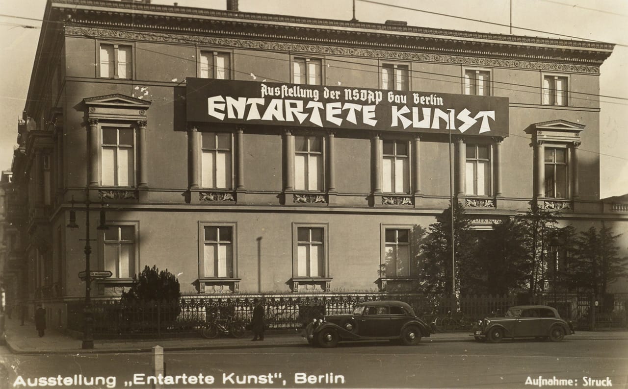 "Entarte Kunst" Berlin exhibition postcard, showing signage on the front of the building at Galeriestrasse 4 (courtesy Swann Auction Galleries)