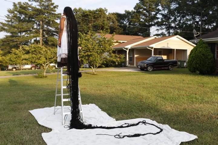 Woman with the world's longest dreadlocks (photograph by Joshua Weinstein, courtesy Sam Green)