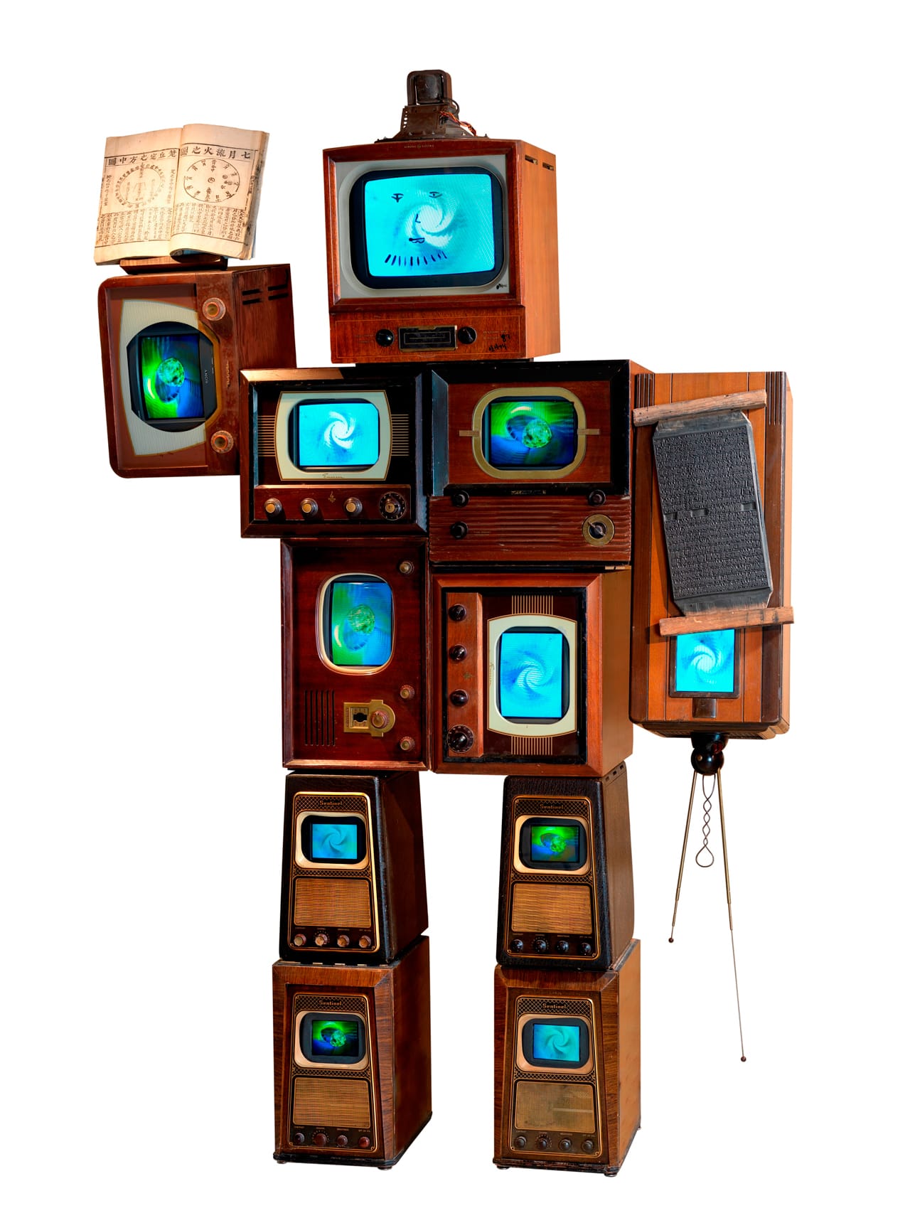 Nam June Paik, "Li Tai Po" (1987), 10 antique wooden TV cabinets, 1 antique radio cabinet, antique Korean printing block, antique Korean book, 11 color TVs, 96 x 62 x 24 in. (243.8 x 157.5 x 61 cm), Asia Society, New York: Gift of Mr. and Mrs. Harold and Ruth Newman (photo © 2007 John Bigelow Taylor Photography, courtesy Asia Society, New York)