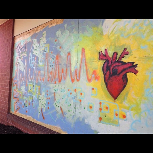 Mural in Ferguson (image via paintforpeacestl/Instagram)