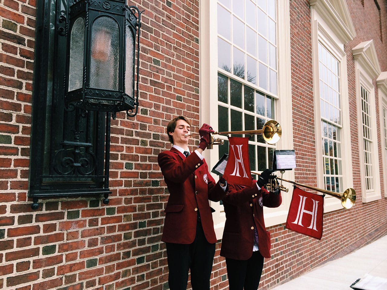 Students playing trumpets on opening day