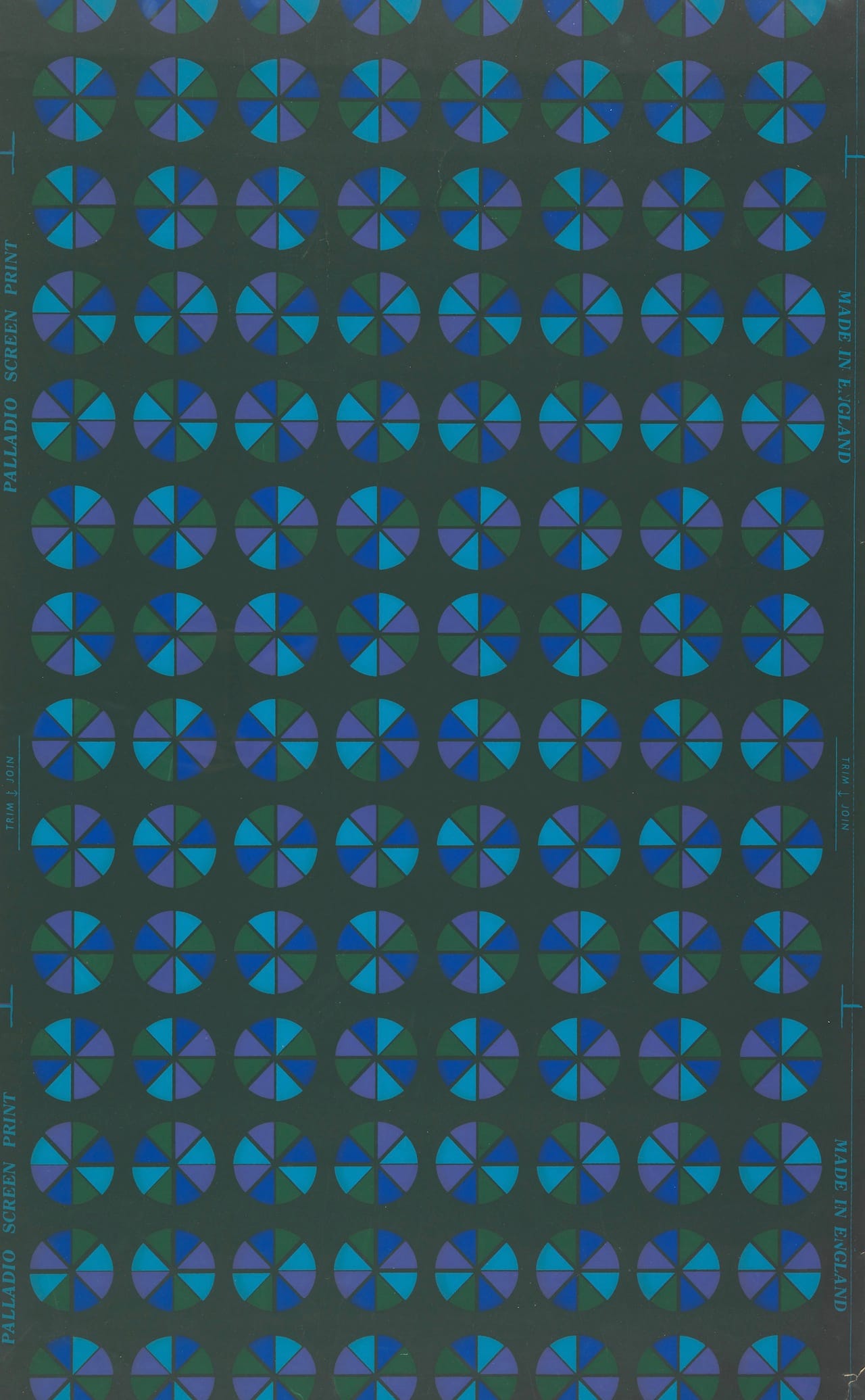 This Palladio screen printed wallpaper features stylized pinwheels in green, blue, and purple on a dark green ground. It was made between 1966 and 1968. 