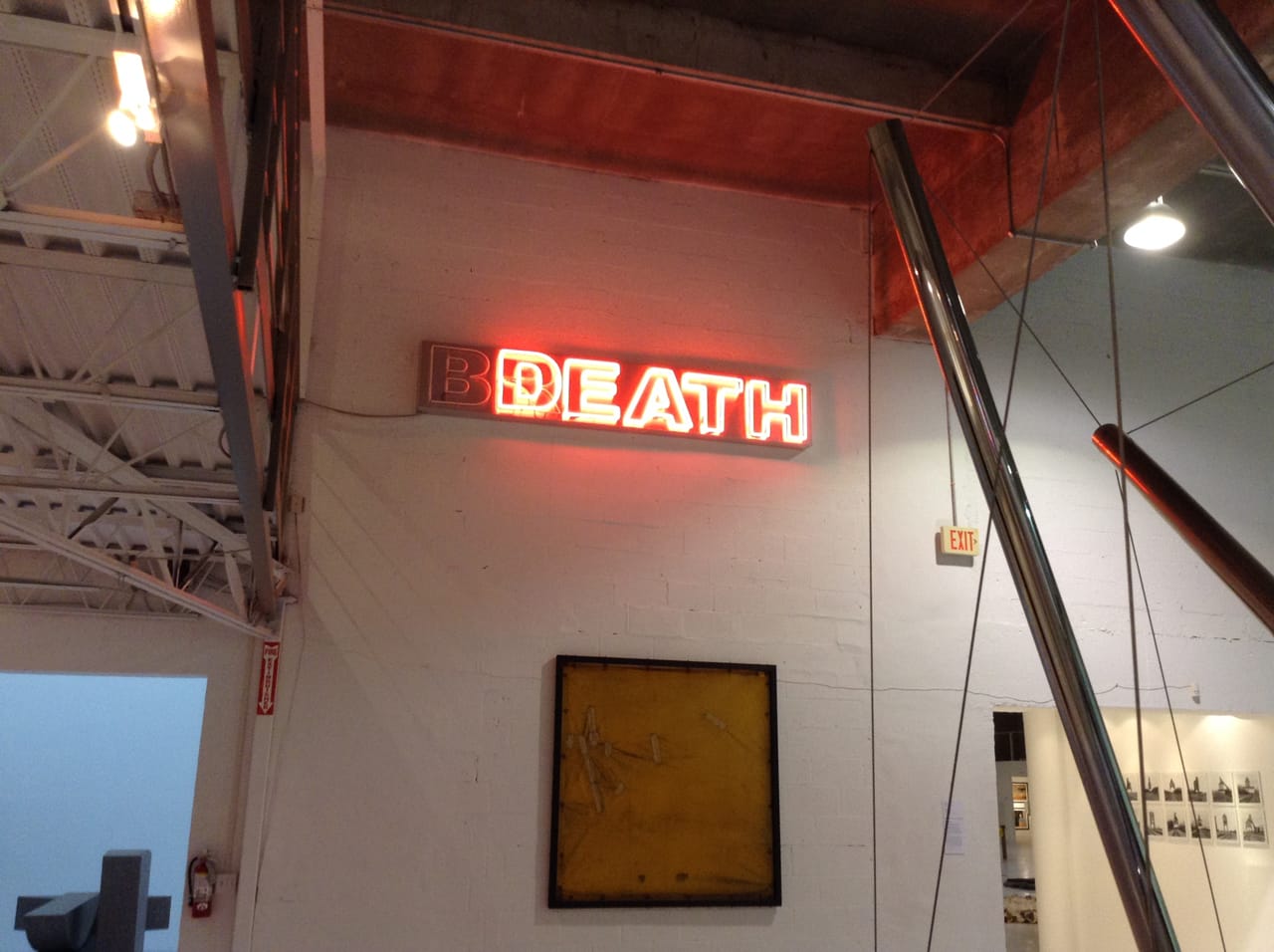 Installation view, Margulies Collection, with neon sign by Kendell Geers