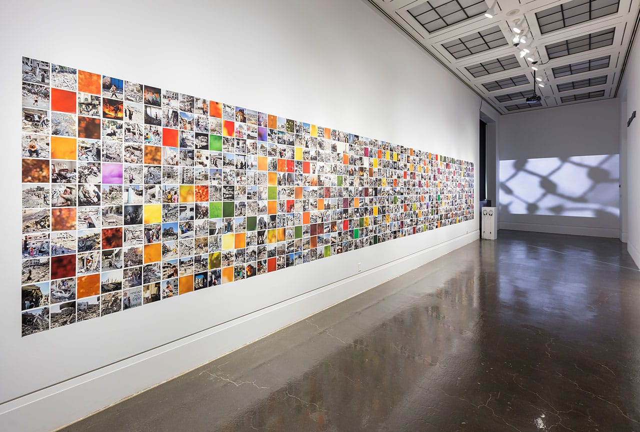 Installation view, 'Rehab Nazzal: Visible' at the Art Gallery of Mississaugua, with "Frames from Gaza" at left and "Bil'in" (2010) in back right (image courtesy Art Gallery of Mississaugua)