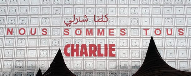 "Nous sommes tous Charlie" (We are all Charlie) in Arabic and French on the facade of the Institut du Monde Arabe (image courtesy IMA)