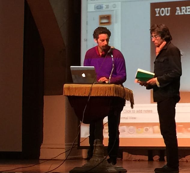 Noah Fischer welcoming Andrew Ross to the stage.