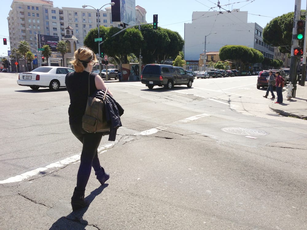 Jessamyn Lovell, "Surveillance (crosswalk)" (2013), from the project 'Dear Erin Hart,': "I followed her out of the store very closely and snapped this shot of her crossing the street to the bus form the second hand store."