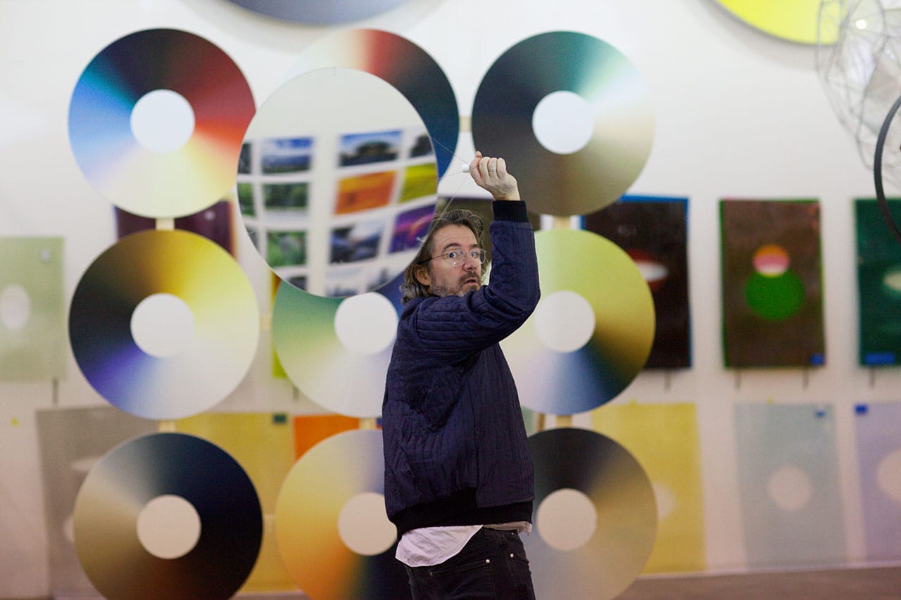 Olafur Eliasson with some of his 'Color Experiment Paintings' (© 2013 Olafur Eliasson)
