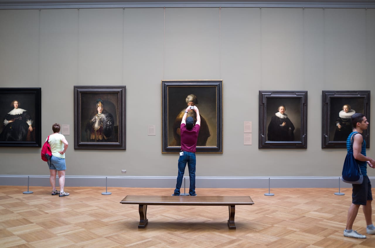 A visitor photographing a painting at the Metropolitan Museum (photo by Phil Roeder/Flickr)