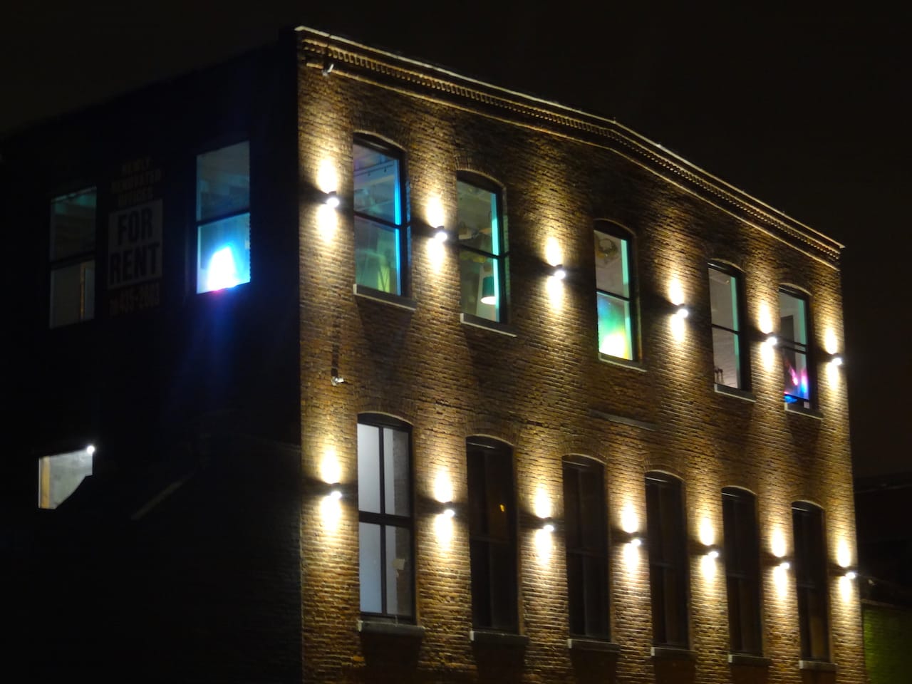 The lights casting "Spectrum II" on the Smith-Ninth Street subway station beaming from the Gowanus Loft