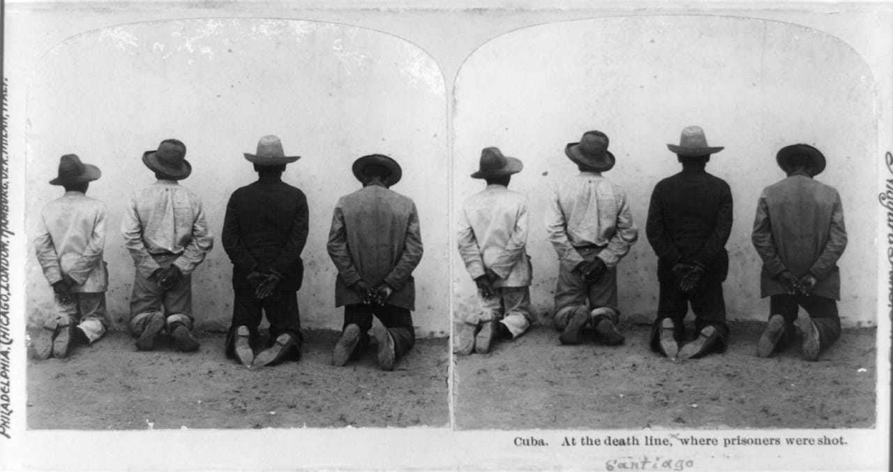 Firing squad during the Spanish American War, published by Griffith and Griffith (1899)
