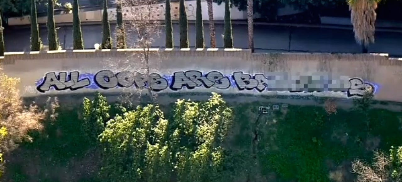 The "All Cops Are Bastards" over Freeway 101 (screenshot by the author from CBS video)