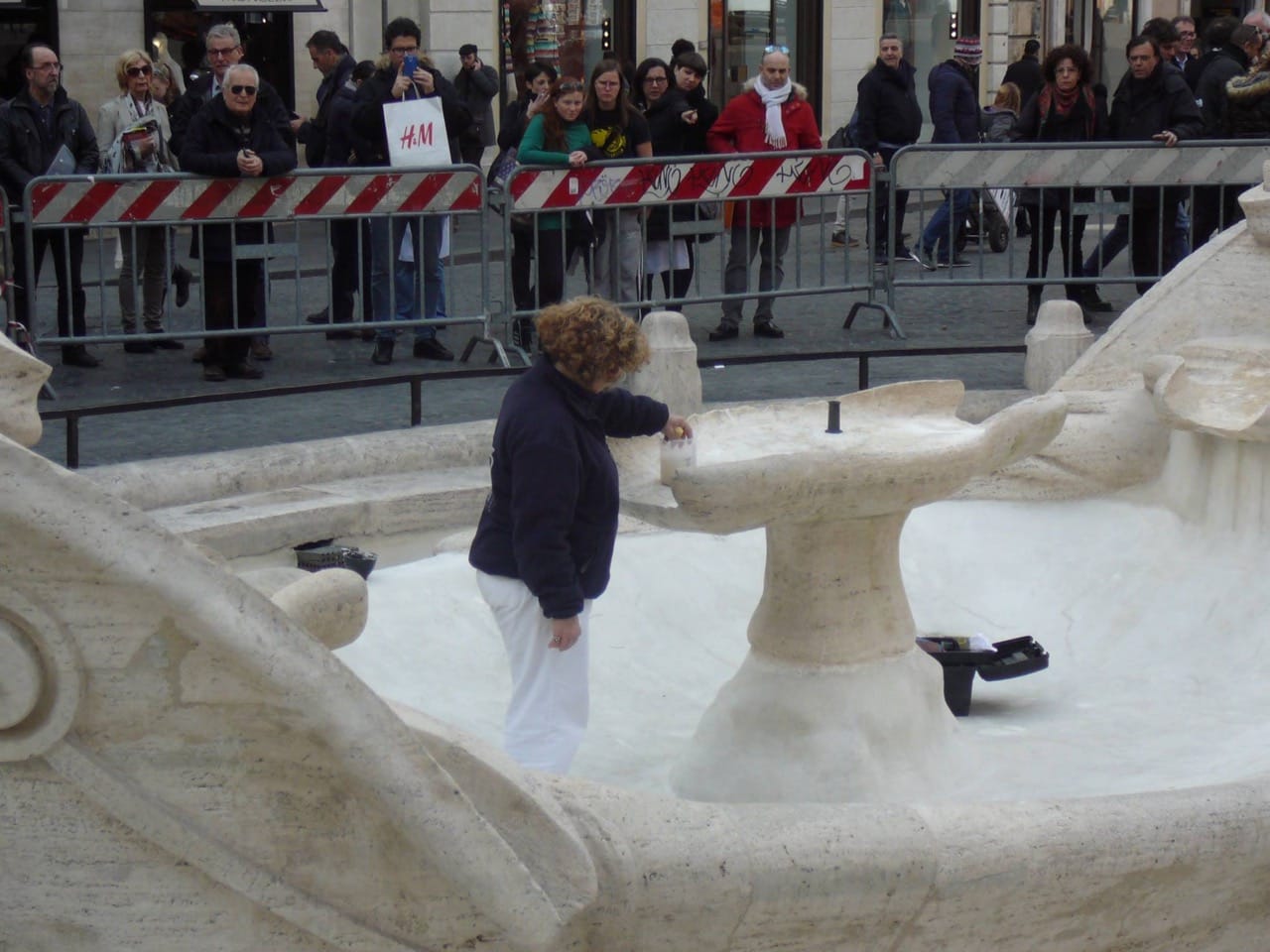 Restorers at work on the fountain