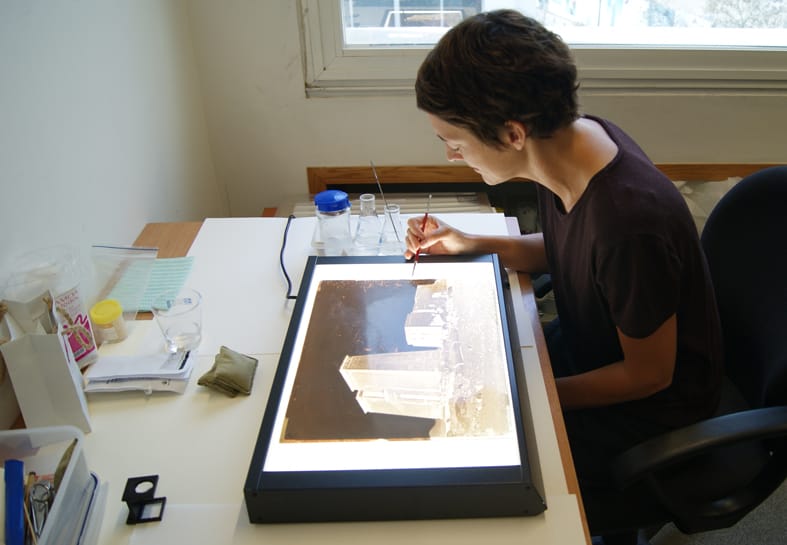 Working on glass plate negatives of the Middle East dating back to the 1860s, taken by the Maison Bonfils in Beirut. Endangered Archives Programme. Photography © Yasmine Chemali