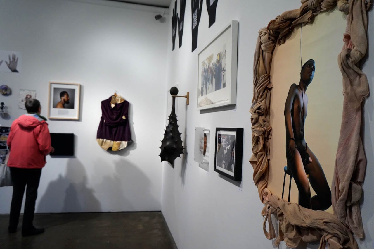 Installation view, 'Respond,' with Elliott Brown's "You & Me" in foreground at right and Kurt Steger's "Fierce Rattle to Quell Anger" (2013) in background (click to enlarge)
