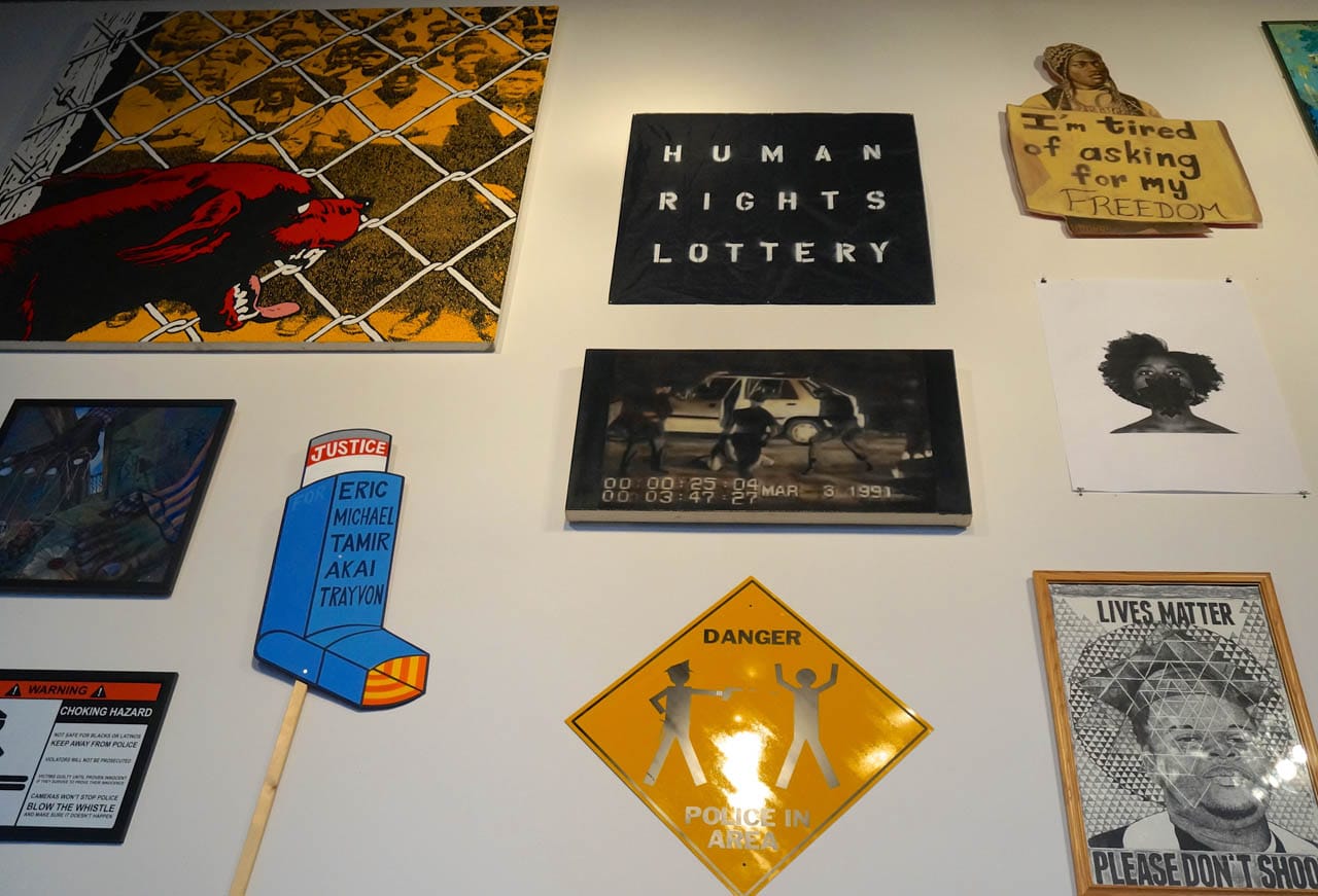 Installation view, 'Respond,' with Jerry Kearns's piece, "Constructive Engagement" (1985), top left