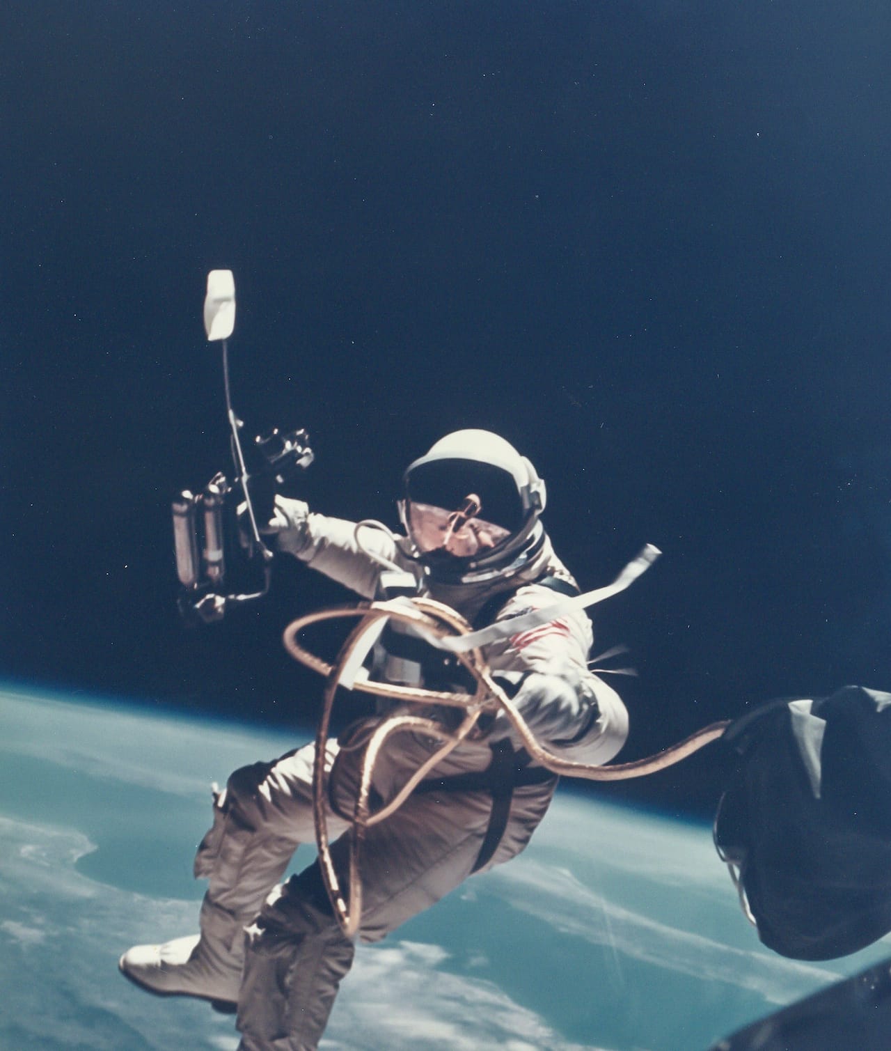 James McDivitt First US Spacewalk - Ed White’s EVA over New Mexico, Gemini 4, 3 June 1965 Vintage chromogenic print flush-mounted to original card, 20 x 25.5cm, image 18 x 15.3cm, [NASA  negative number S-65-30433A] Provenance: The personal collection of Ed White&nbsp;, Heritage Auctions, Sale 6082, lot Captivated by the experience of his spacewalk, Ed White resisted repeated calls from Houston to get  back to the craft: Est. £800-1,200 Reproduction, © Bloomsbury Auctions