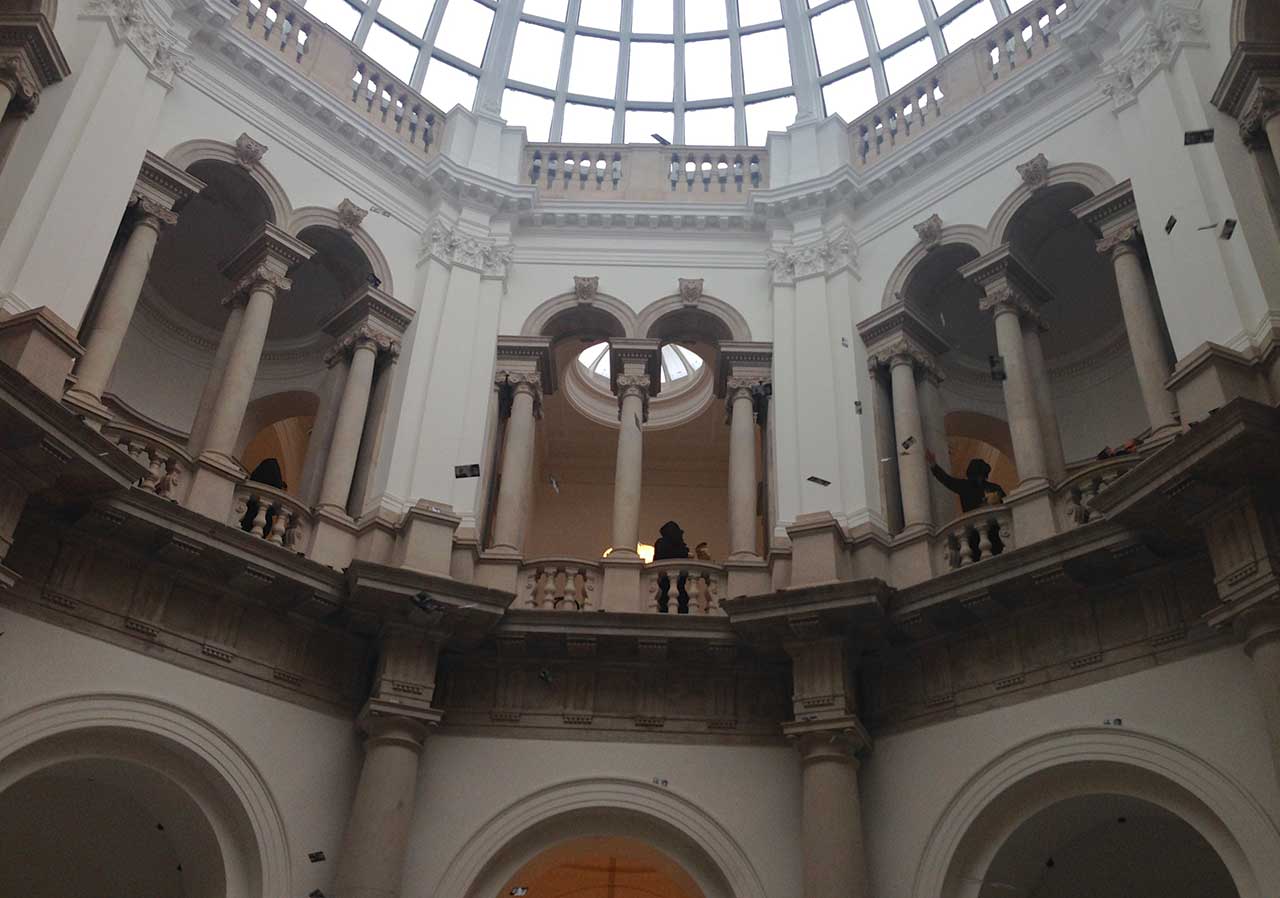 Liberate Tate members dropping fake money at Tate Britain (all photos by the author for Hyperallergic)