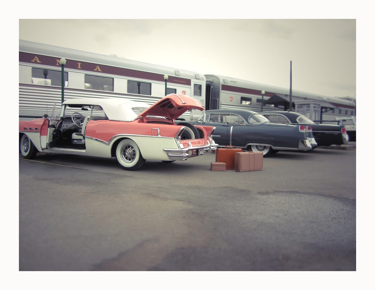 Heading Out of Town  It was an overcast, blustery, early spring day when this photo was taken and Cliffton Lint, the son of Durwood Lint, was heading out of town for a long weekend. The nature of his trip was anybody's guess, but knowing the Lints, it had the whiff of dubious dealings. But aside from all that, his car, a 1956 Buick Roadmaster convertible, was the cat's pajamas.  