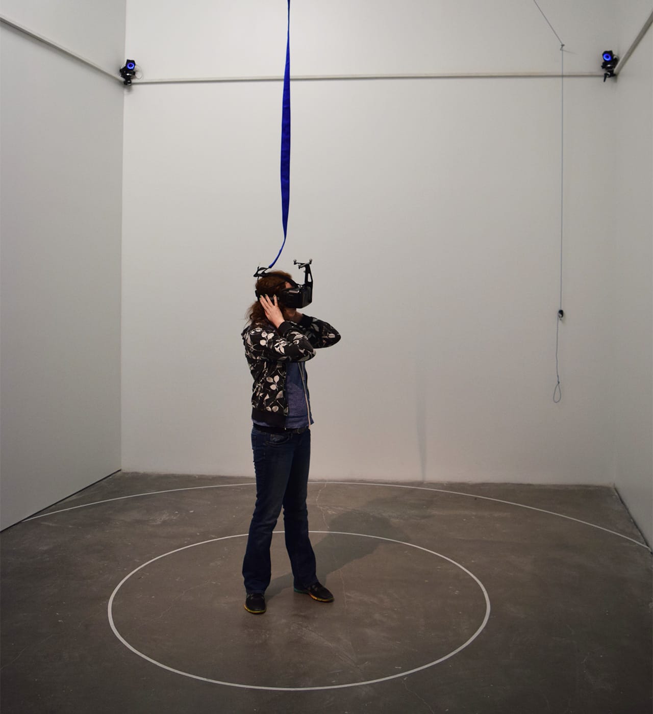 A visitor exploring Daniel Steegmann Mangrané's Oculus Rift piece "Phantom" (2015)