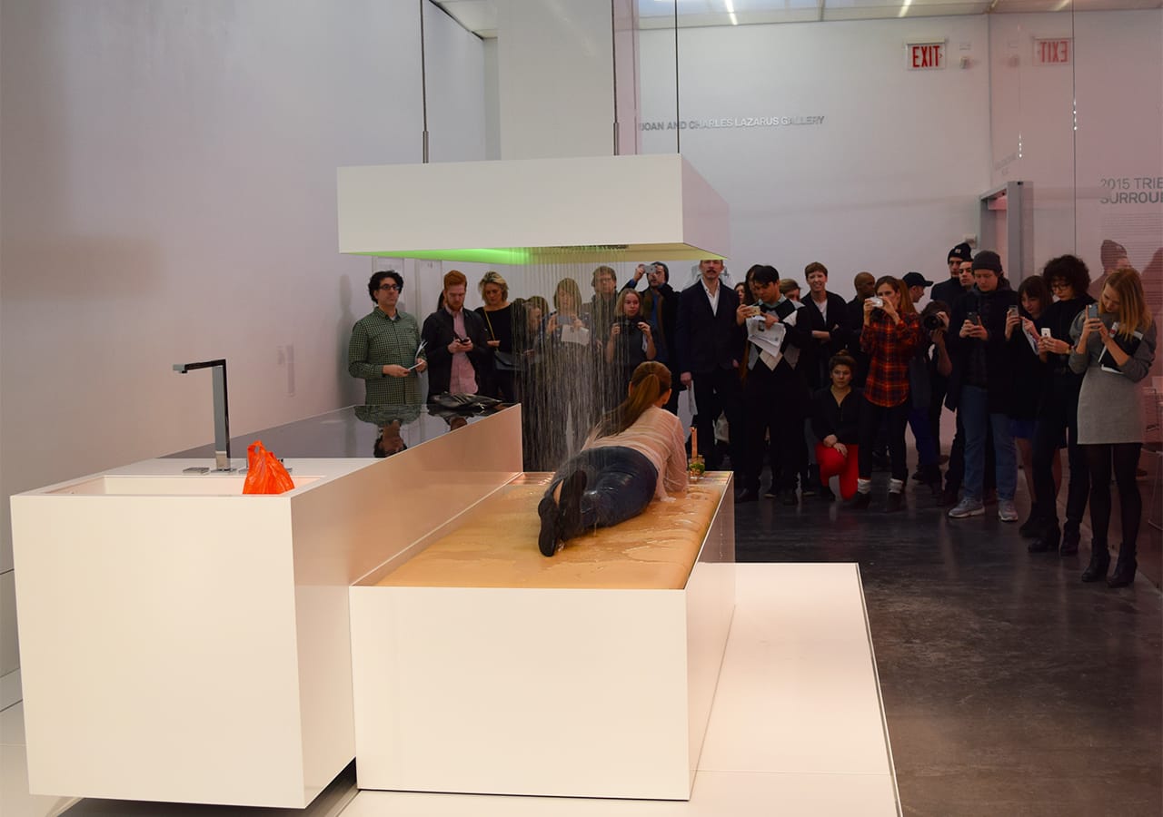 Visitors watch a performance of DIS's "The Island (KEN)" (2015)