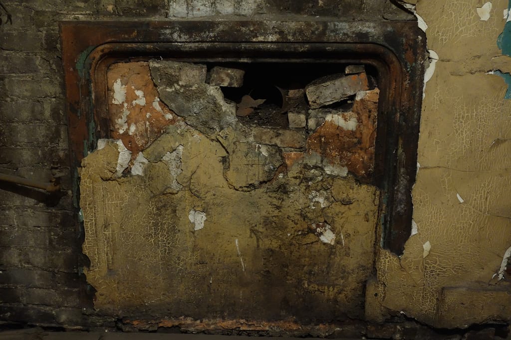 An unrestored fireplace