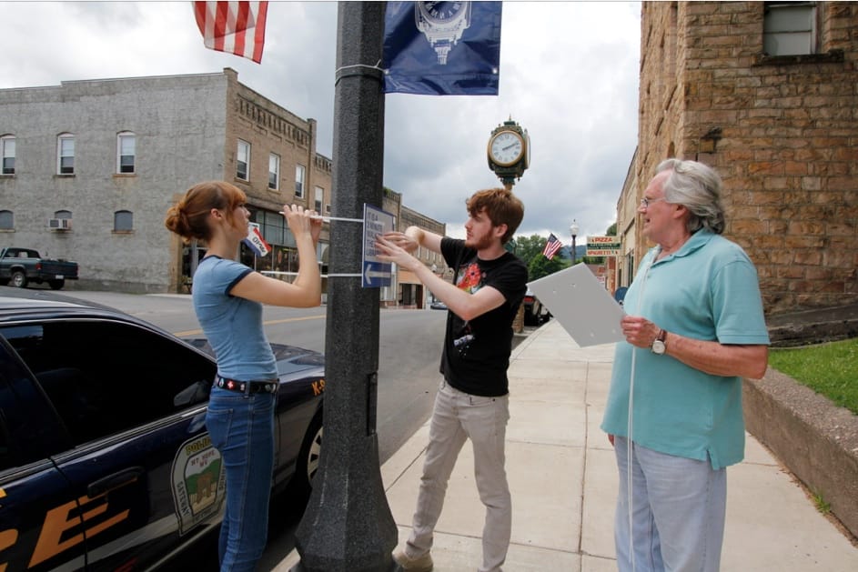 Installing a sign in Mount Hope, West Viriginia (courtesy Walk [Your City])