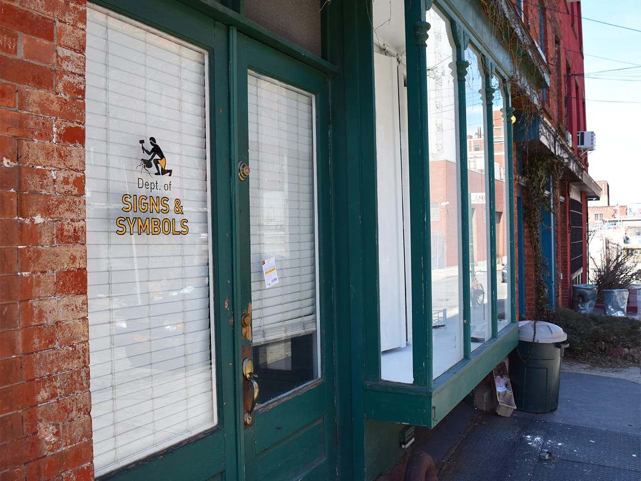 The front door of the Department of Signs and Symbols at 54 Hudson Avenue, Brooklyn (all photos by the author for Hyperallergic)