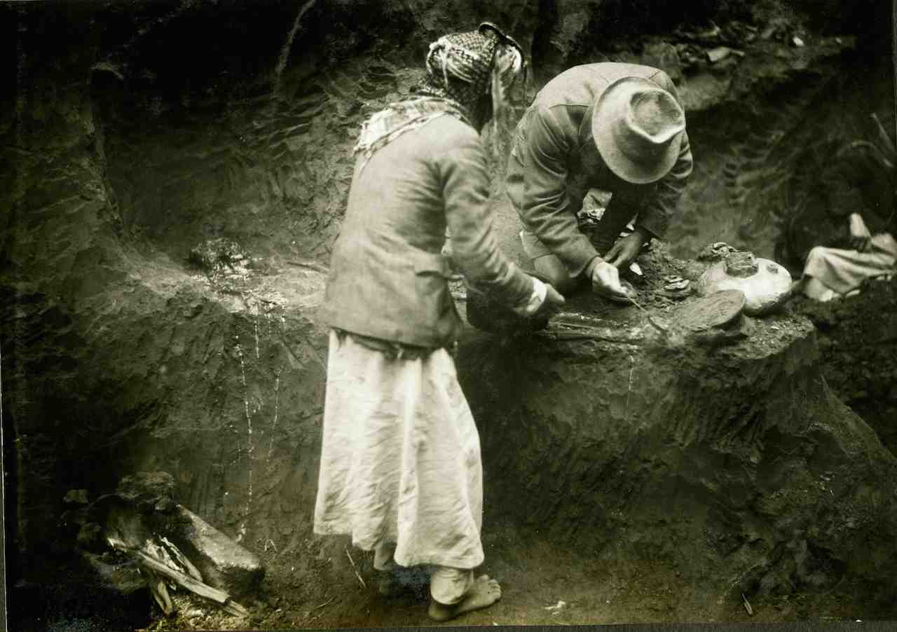 Leonard Woolley waxing a skeleton for removal (courtesy Institute for the Study of the Ancient World)