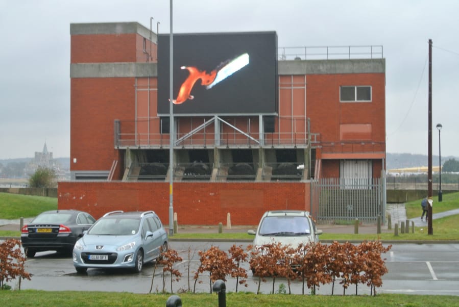 Adam Chodzko's "Great Expectations" (2015) as seen from Chatham Bus Station (all photos by the author for Hyperallergic)