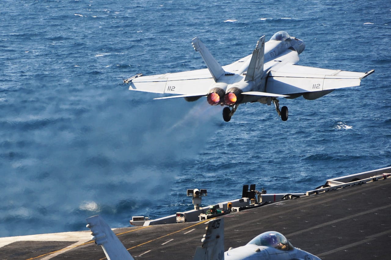 ARABIAN GULF (Oct. 13, 2014) An F/A-18E Super Hornet assigned to the Tomcatters of Strike Fighter Squadron (VFA) 31 launches from the flight deck of the aircraft carrier USS George H.W. Bush (CVN 77). George H.W. Bush is supporting maritime security operations, strike operations in Iraq and Syria as directed, and theater security cooperation efforts in the U.S. 5th Fleet area of responsibility. (U.S. Navy photo by Mass Communication Specialist 3rd Class Joshua Card/Released) 141013-N-CZ979-097 Join the conversation http://www.navy.mil/viewGallery.asp http://www.facebook.com/USNavy http://www.twitter.com/USNavy