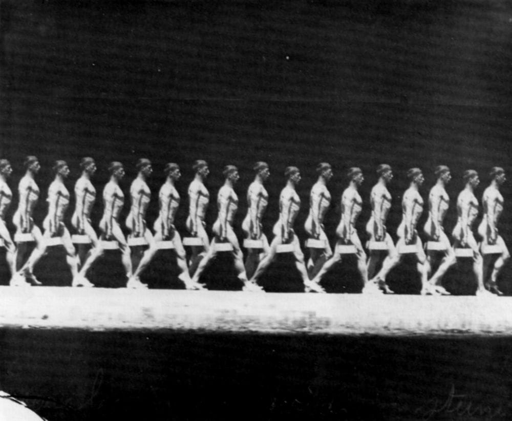 Walking man carrying a weight (1885), photographed by Étienne-Jules Marey (via Wikimedia)