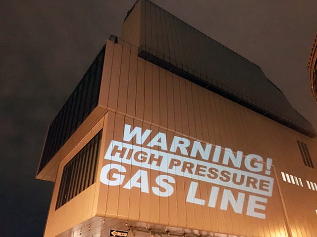 The Illuminator branded the museum with various messages highlighting the hidden gas line underneath its pristine building.