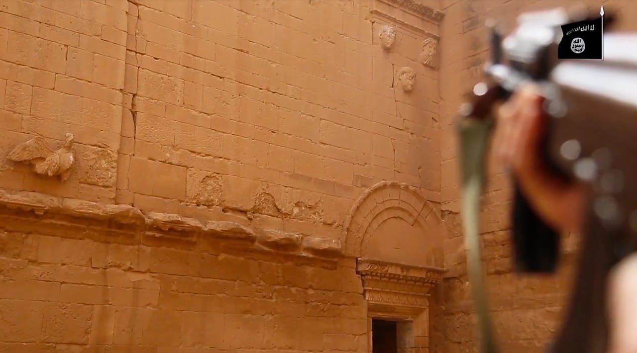 Using a rifle to destroy a sculpture