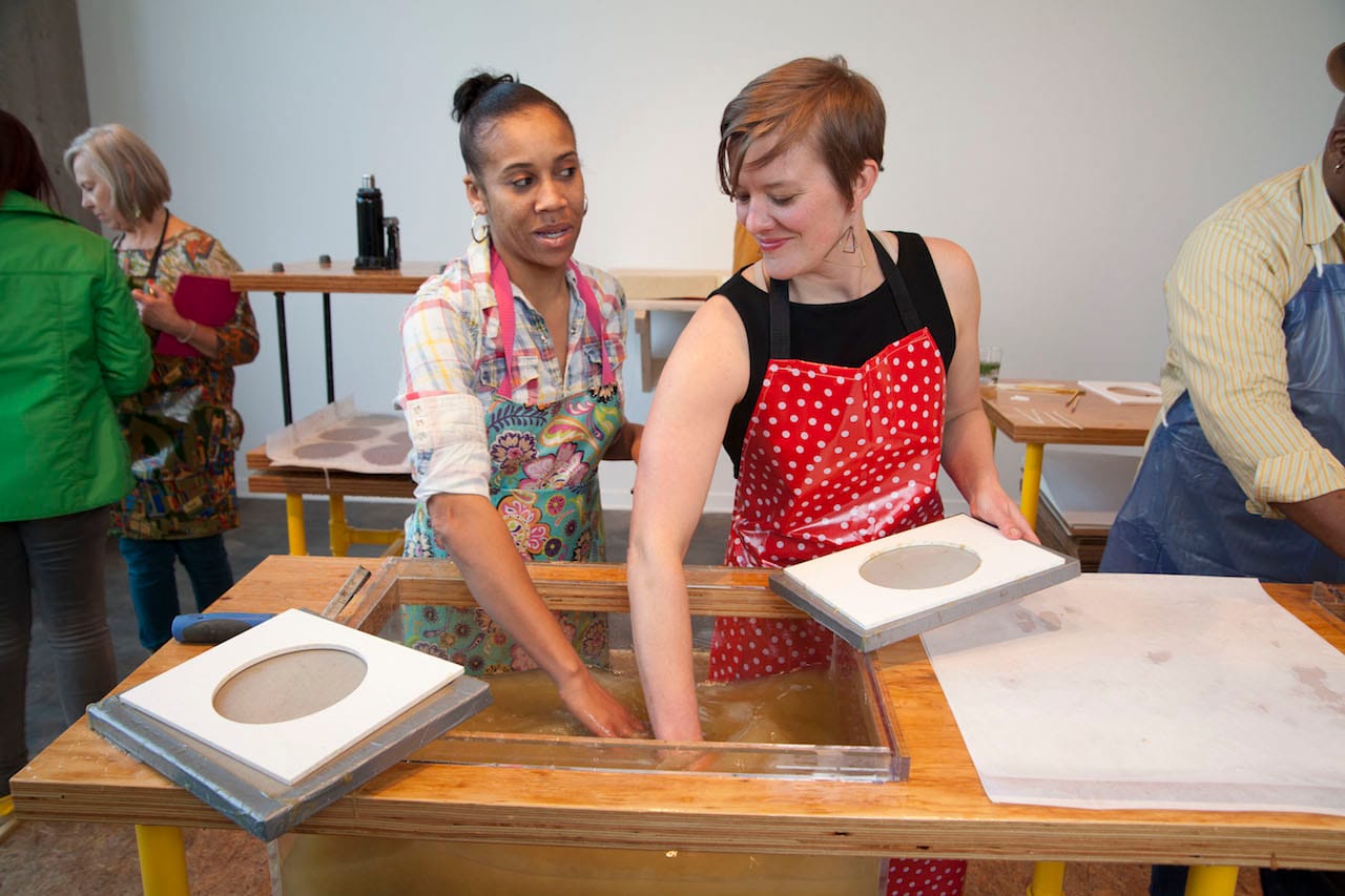 Collaboration in progress between Heeres (right) and a gallery visitor. Photo by Eric Wheeler.