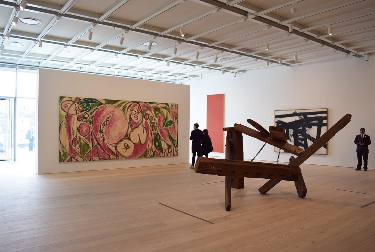 Sunlight pours in from the building's all-glass western façade