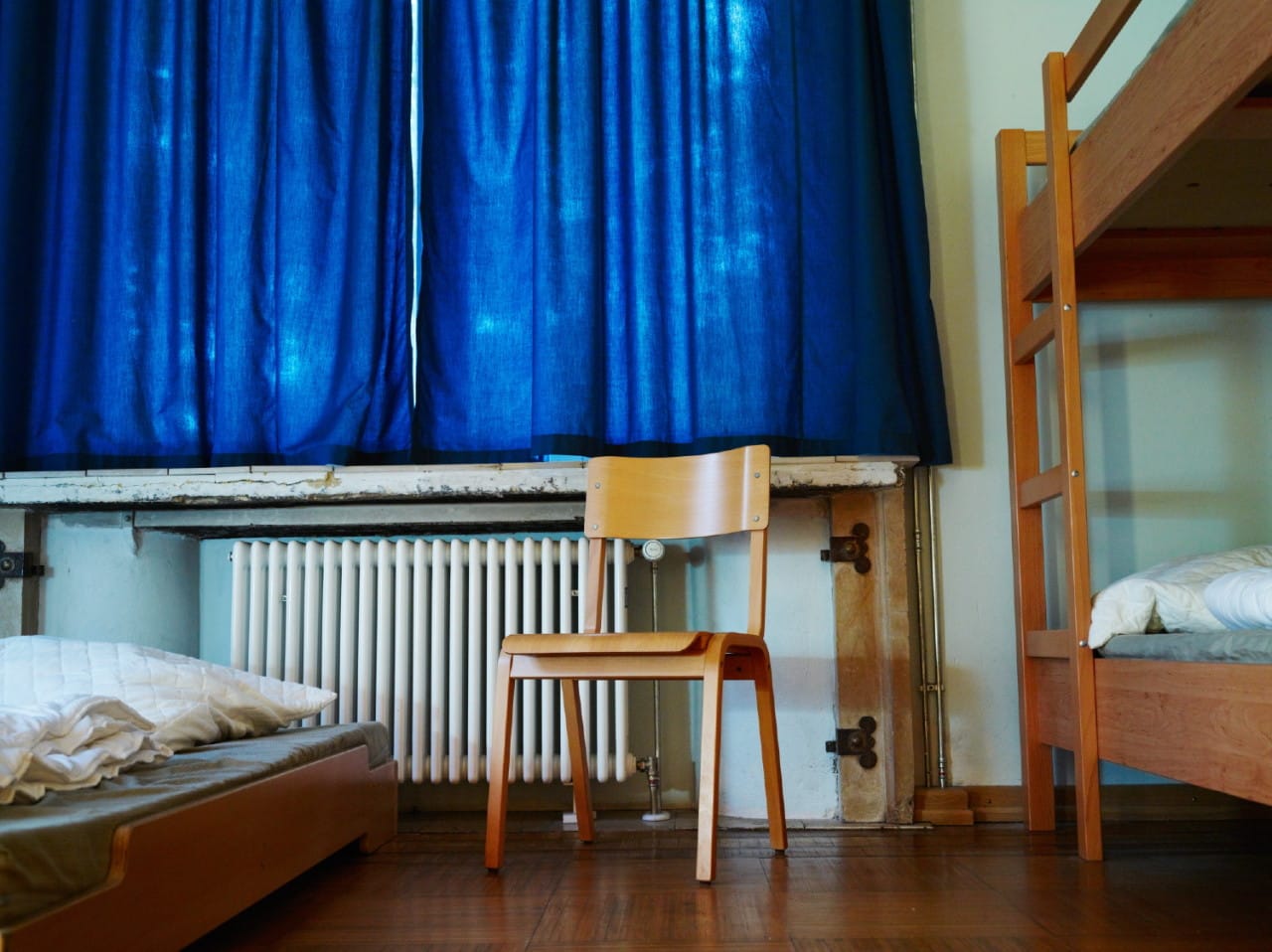 Jegor Zaika, "Germany, Oranienburg" (2014): Bedroom in a hostel near Sachsenhausen concentration camp site. It is the converted villa of self-titled “Concentration Camp Inspector” Theodor Eicke, influential figure in the establishment of the camp system.
