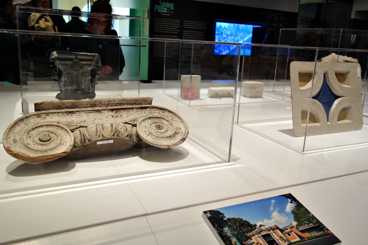 At left: a portion of a wooden capital from a stairway in the Octagon, designed in the 19th century and salvaged from a 1982 fire