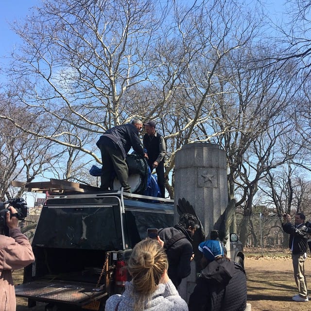Employees of the New York City Parks Department removing the Edward Snowden bust from its pedestal