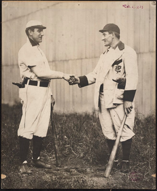 Baseball players Napoleon Lajoie and Honus Wagner in 1904 (via Boston Public Library). A baseball card featuring Wagner sold for TK at auction.