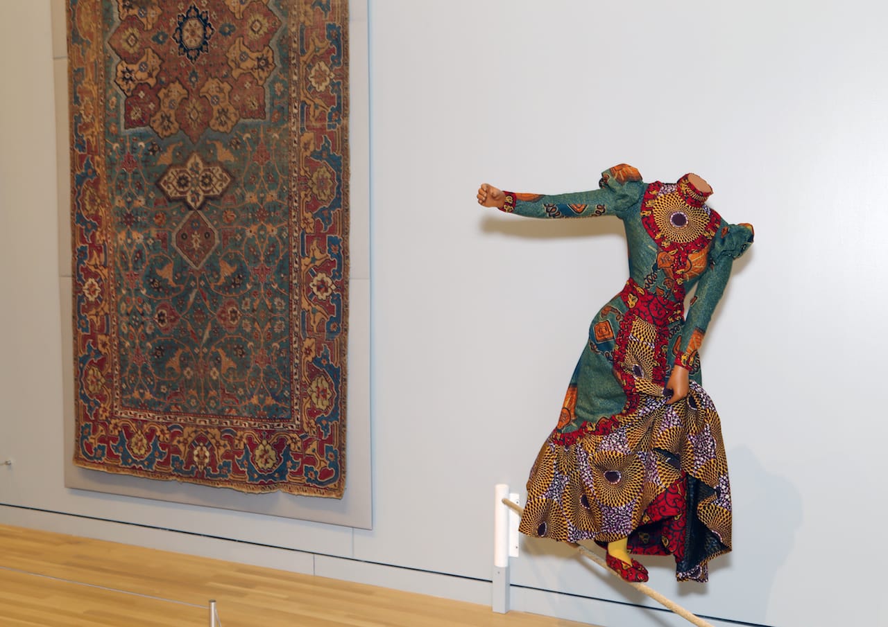 Yinka Shonibare MBE, "Lady Walking a Tightrope" (2006) (Newark Museum, purchase 2007 Helen McMahon Brady Cutting Fund; image courtesy of the Newark Museum)